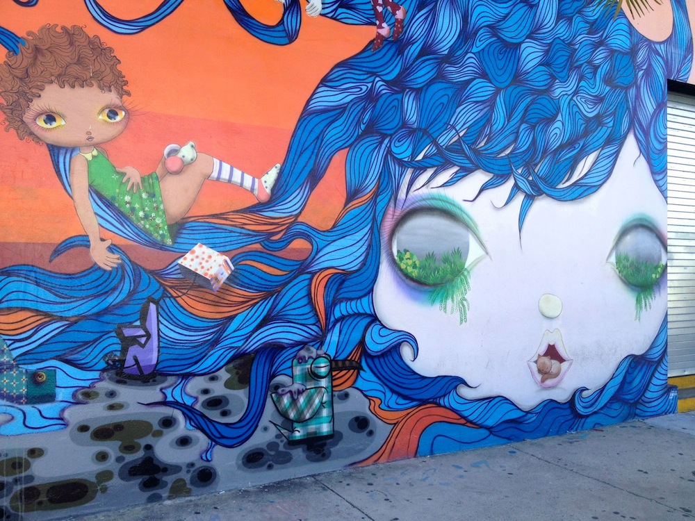 mural girl riding the waves of hair flow