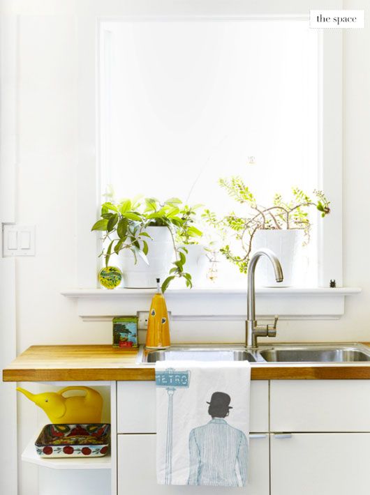 Kitchen with plants featured on covet garden  via sfgirlbybay