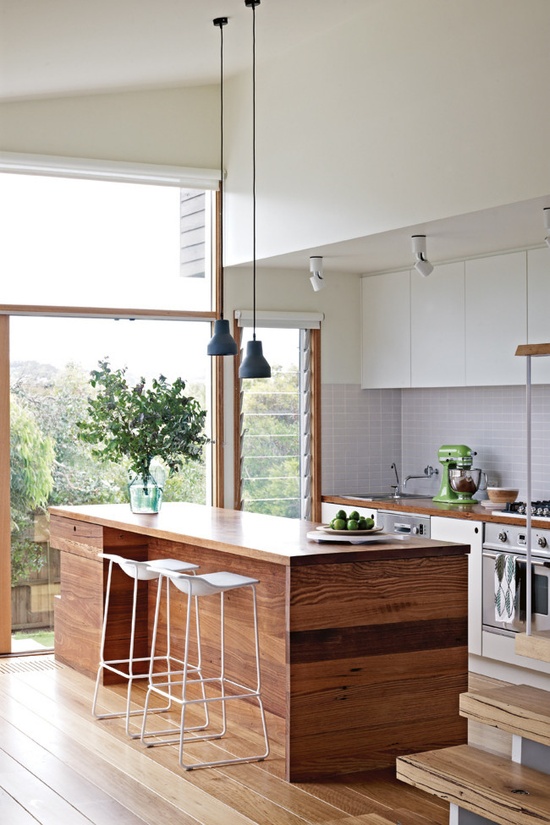 Light and spacious kitchen with natural  wood and lovely views. Photo by Mark Roper via dustjacketattic