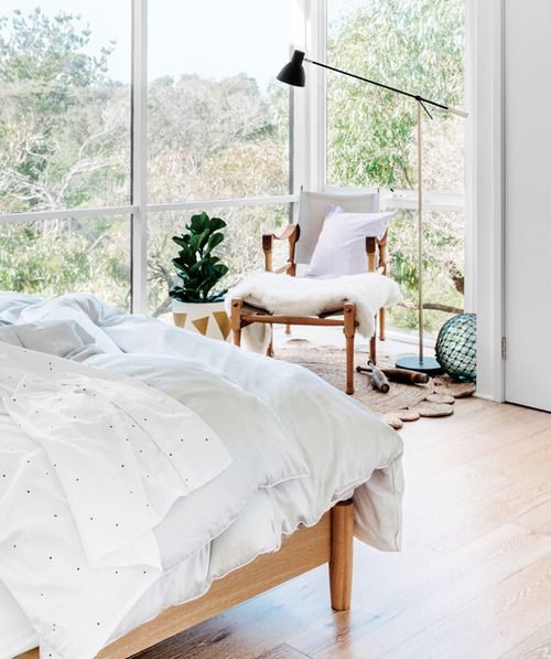 light filled bedroom with a view